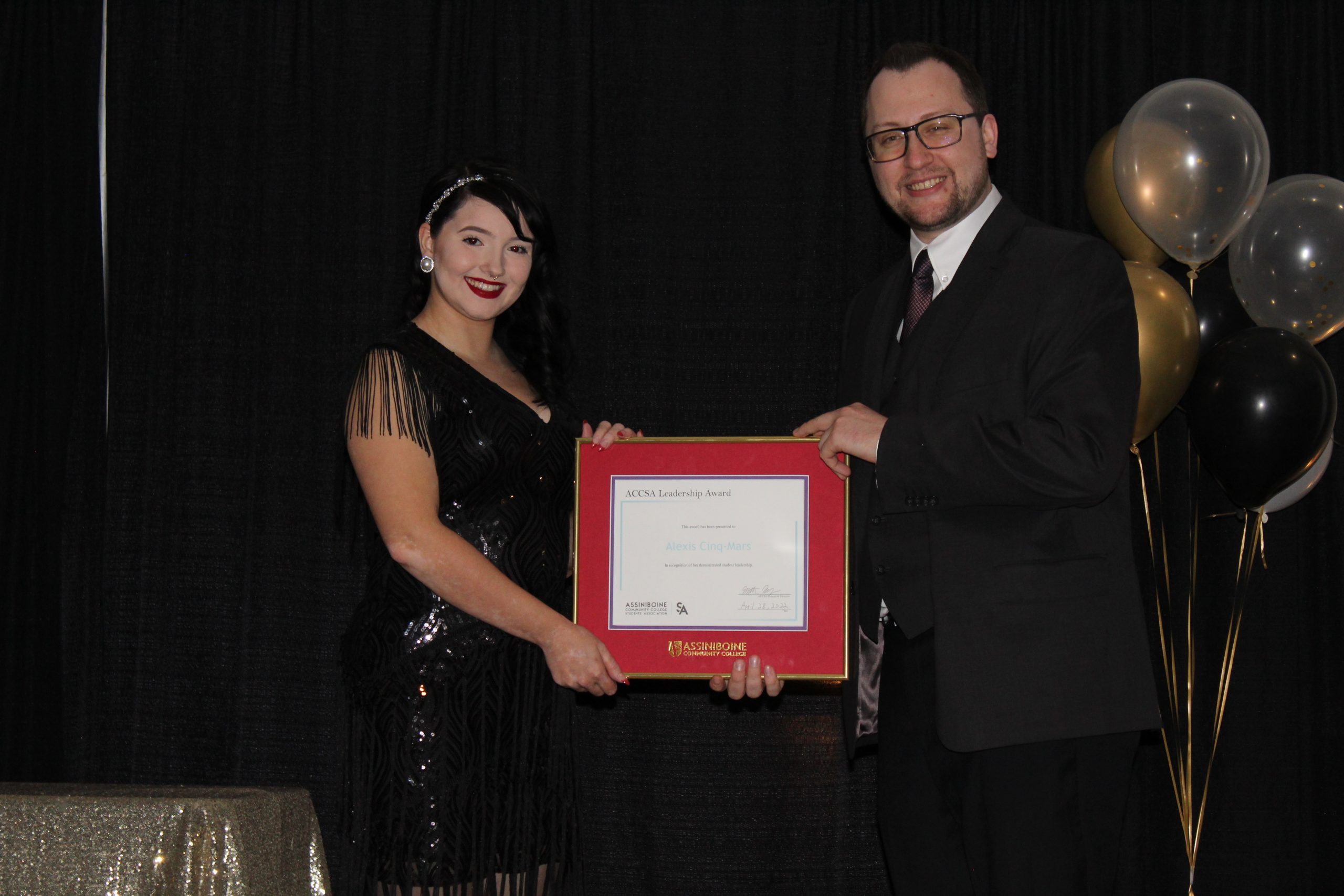 Alexis Cinq-Mars receives an ACCSA Leadership Award, presented by Matthew May, Executive Director, ACCSA 